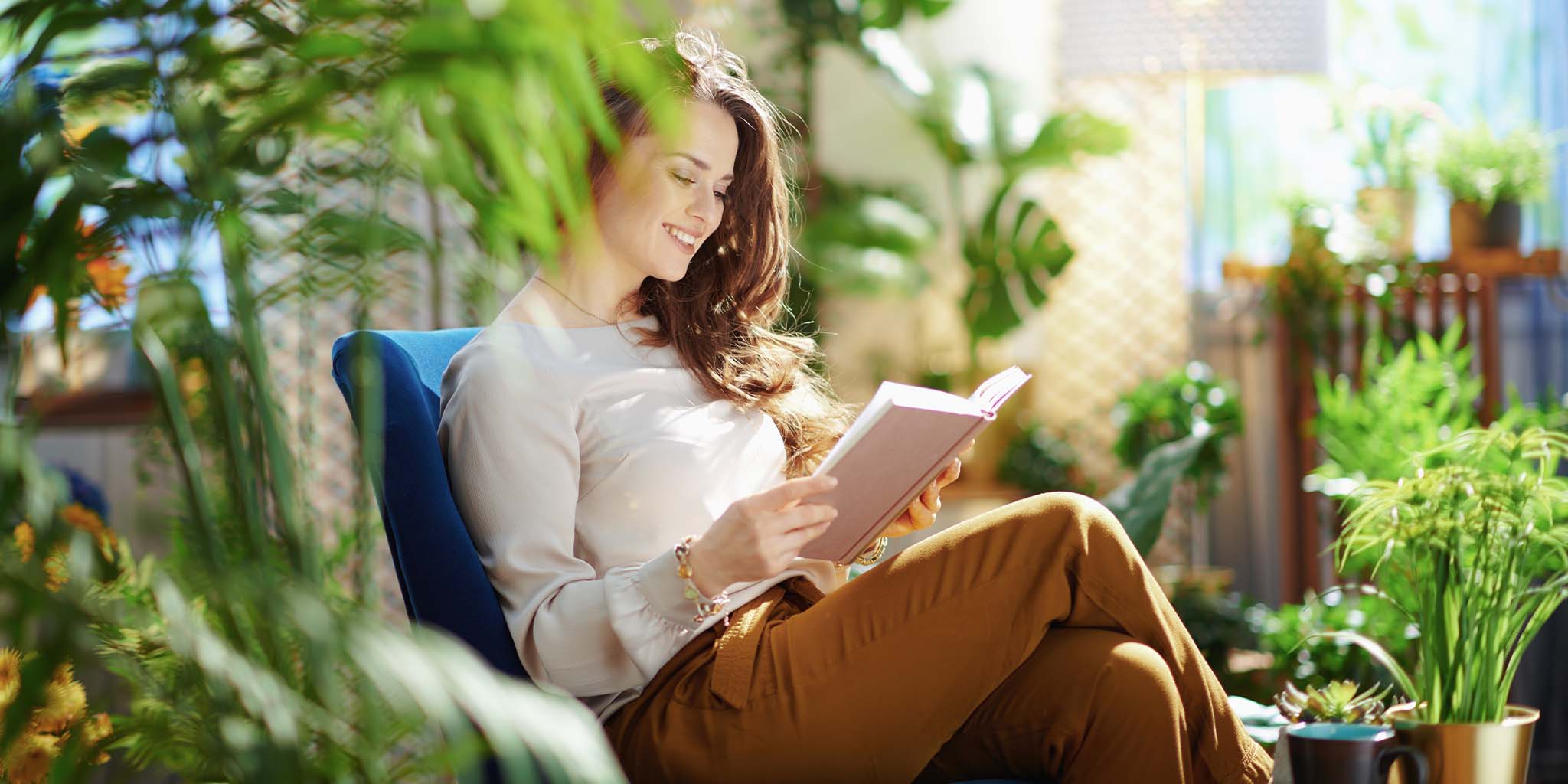 House Plants with a lady reading a book